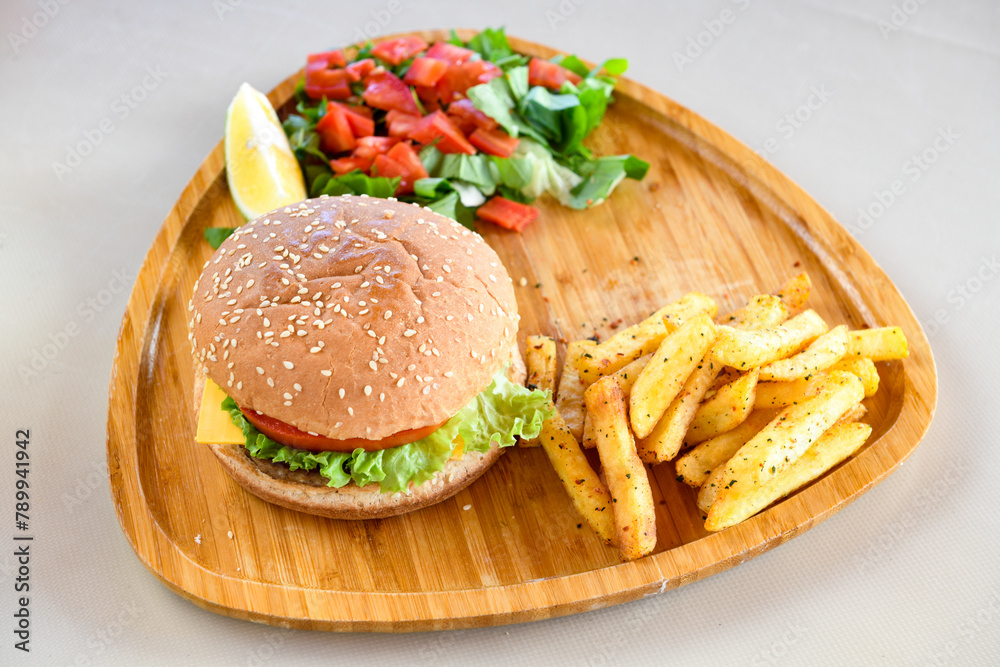 Big tasty burger with beef cutlet on a plate. Hamburger, cheeseburger with mushroom. Crispy chicken burger. Big tasty burger with beef cutlet on a plate. Hamburger, cheeseburger with mushroom. Crispy chicken burger.