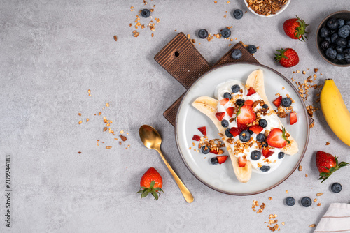 Healthy Banana Split Breakfast with Yogurt, Granola and Fresh Berries