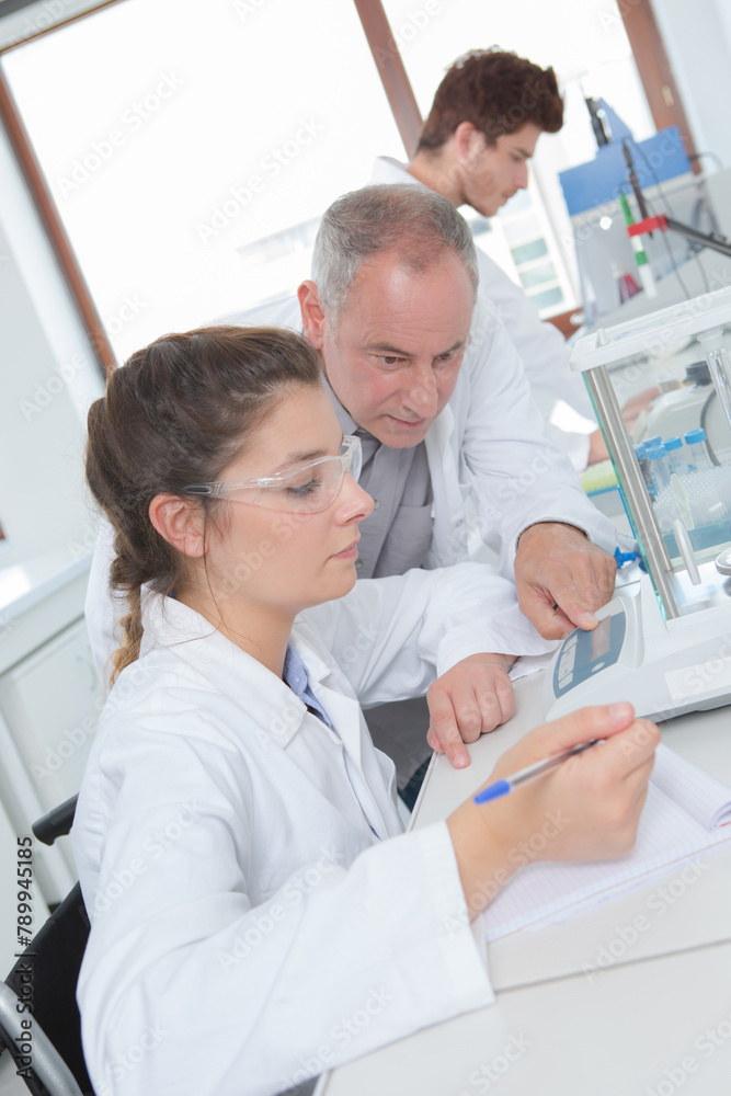 team of scientists in laboratory
