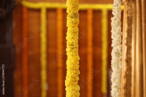 background made of bells and marigold flowers can be used as wedding backdrop and as copy space