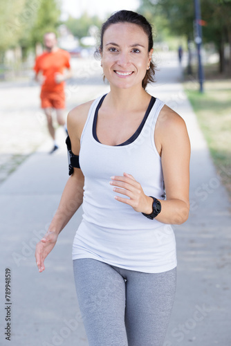 a woman is jogging outdoors