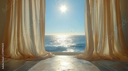 A window with curtains open to the ocean. The curtains are white and the sun is shining through them. The scene is peaceful and calming