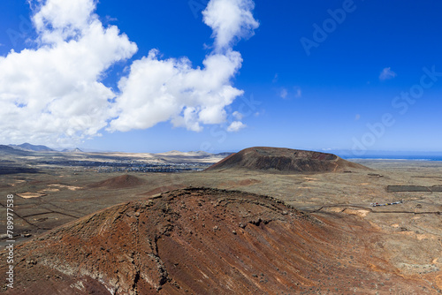 Dramatic aerial image of the volcanic mountains landscape and Calderon Hondo near Corralejo in Fuerteventura Canary Islands Spain