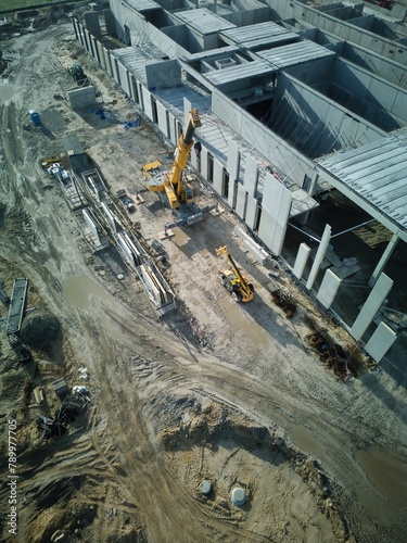 A drone view of construction of a new supermarket, logistics center, and development contributing to the economic growth of suburban areas. photo