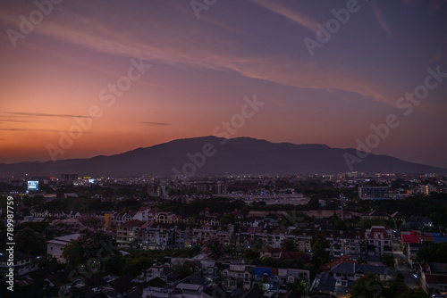 View of Doi Suthep mountain and Chiang Mai after sunset.  Thailand