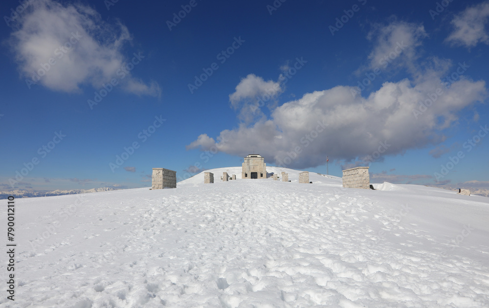 Pieve, TV, Italy - March 13, 2024: Military Ossuary Memorial of Monte Grappa and white snow