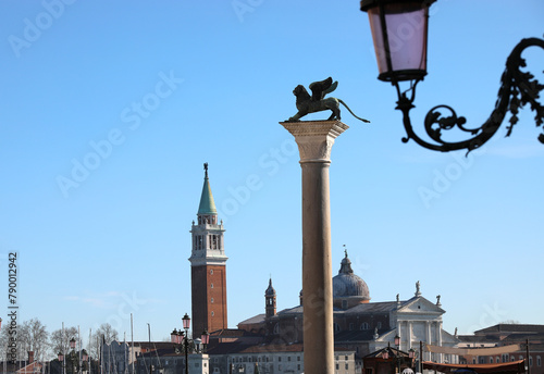 Venice, VE, Italy - February 13, 2024: bell tower of Saint George Basilica with winged lion symbol of VENEZIA