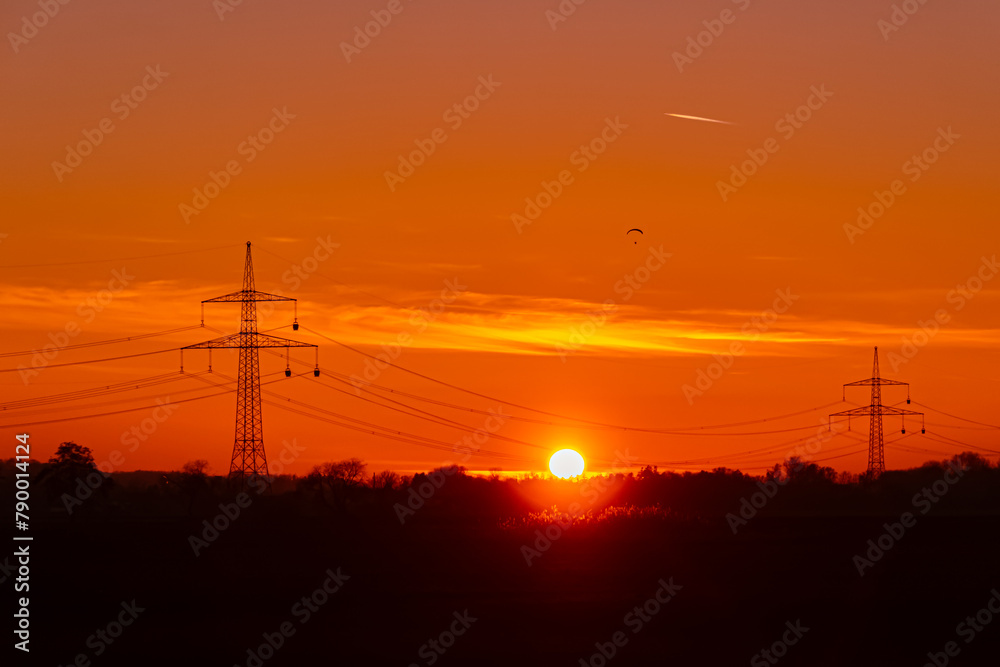 Sunset with overland high voltage lines at Huett, Eichendorf, Dingolfing-Landau, Bavaria, Germany