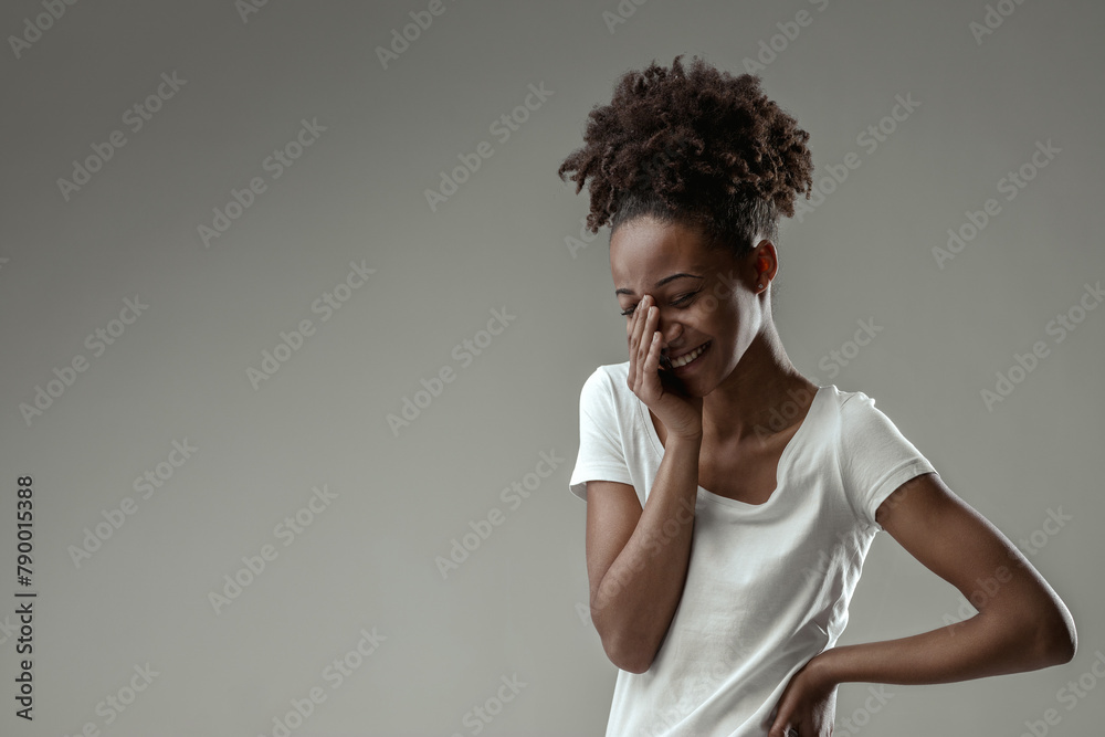 Gleeful expression reveals delightful conversational reaction Gleeful expression reveals delightful conversational reaction