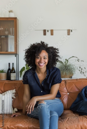 Woman Sitting on Couch With Bottle of Wine