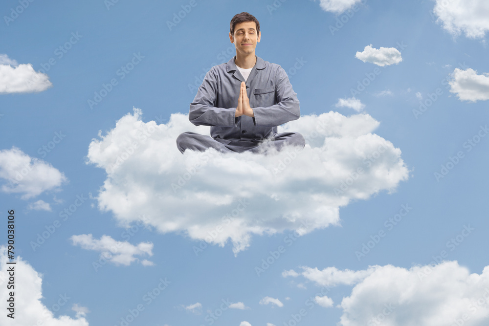 Man in pajamas floating on a cloud Man in pajamas floating on a cloud