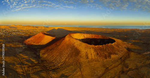High aspect aerial panoramic view of Volcan Calderon Hondo volcano and crater at sunrise near Lajares Corralejo in Fuerteventura Canary Islands Spain