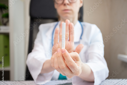 refuse smoking, stop cigarette, doctor shows a sign of rejection of cigarette with her hand
