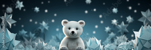 A white teddy bear is sitting in a field of paper stars