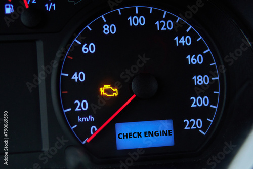 Check engine error light illuminated on car dashboard
