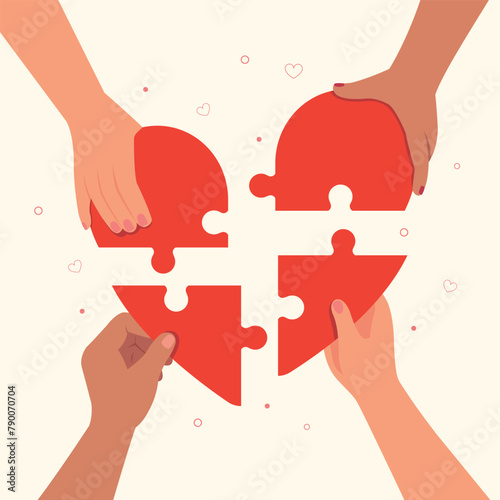 Hands connect a pieces of heart puzzle together. Charity and donation. Give and share your love to people. 