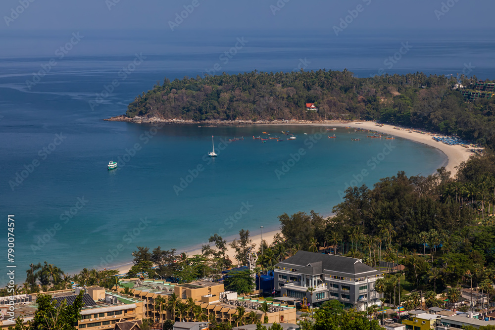 Beautiful beach with colorful water. Top view of the beautiful coastline. Sunny summer day. Colorful water. Sandy beach.	

