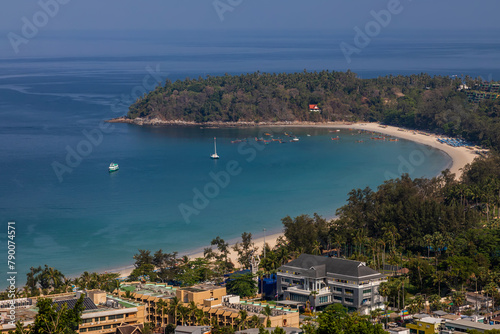 Beautiful beach with colorful water. Top view of the beautiful coastline. Sunny summer day. Colorful water. Sandy beach.	
