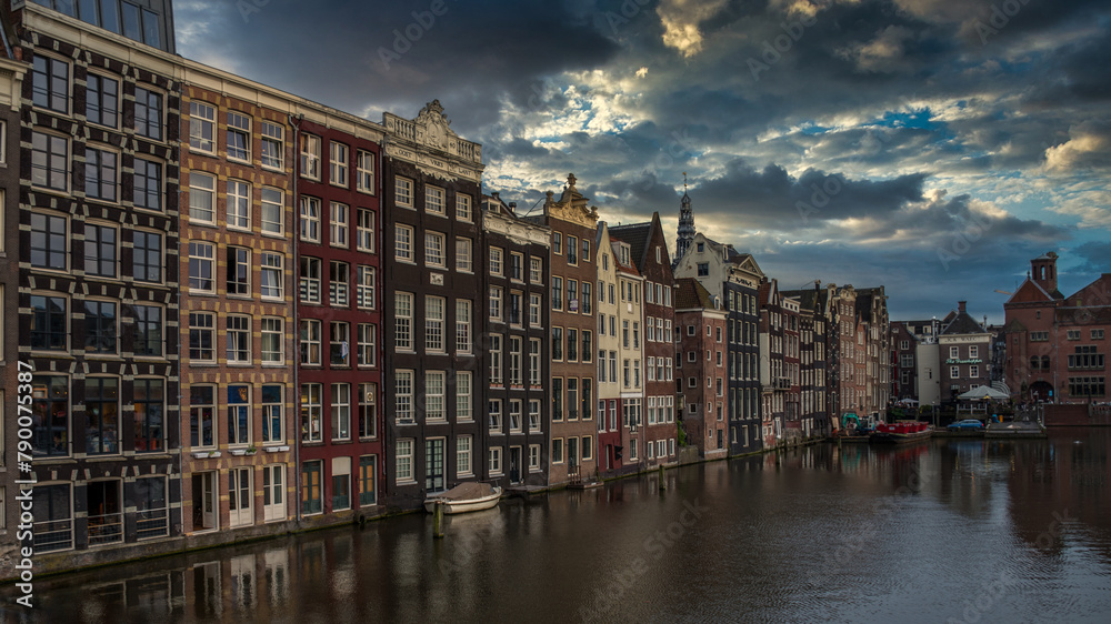 Traditional Amsterdam architecture on Damrak canal, Netherlands