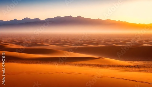 Sahara-desert-at-sunrise--mountain-landscape-with-dust-on-skyline--hills-and-traces-of-the-off-road-car photo