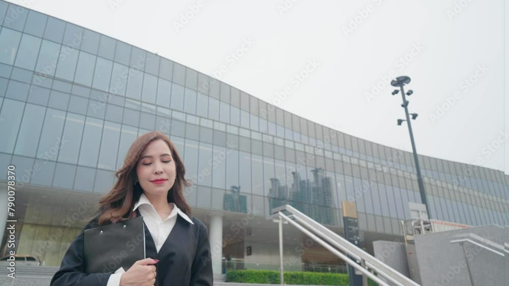 Elegant businesswoman walking out from the building, female career path confident attitude before attending to work offices, office building or workplace. Leadership, power of feminine concept Elegant businesswoman walking out from the building, female career path confident attitude before attending to work offices, office building or workplace. Leadership, power of feminine concept