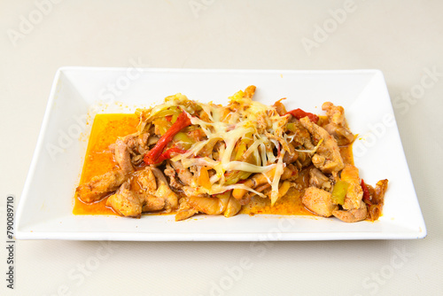 Turkish and Arabic Traditional Ramadan doner kebab with tasty tomato sauce and rice or turkish pilav in white plate on wood table background. ( Pilav ustu doner). Ekmek arasi doner, doner durum.  photo