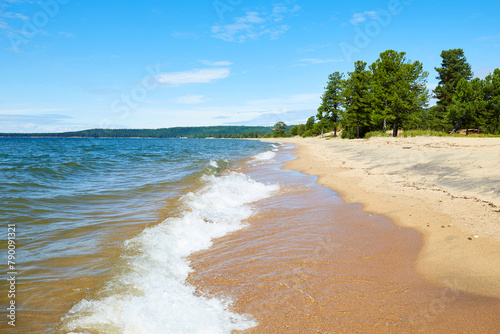 Beautiful sandy beach on a sunny summer day, seascape. photo