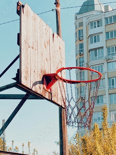 Basketball flying into the basketball hoop. Footage of a ball flying into the basket. Slow motion video from below the basket with the ball flying in. Goal