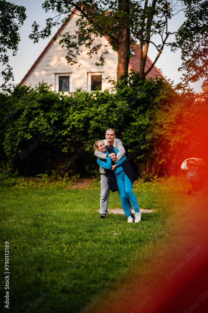 A loving embrace captured in the soft light of the golden hour, a couple cherishes a serene moment in a lush garden setting A loving embrace captured in the soft light of the golden hour, a couple cherishes a serene moment in a lush garden setting