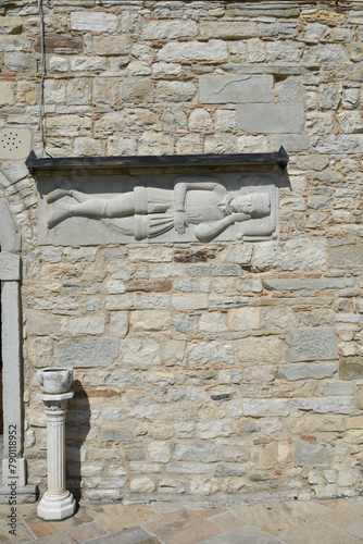 An ancient statue on the wall in Roseto Valfortore, a medieval village in the province of Foggia in Italy.
