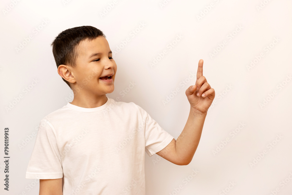 The boy raised his index finger, attracting attention. The boy raised his index finger, attracting attention.