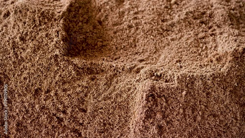 Mixing soil for growing mushrooms.