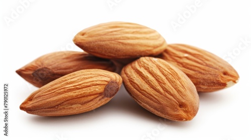 Close-up of stack almonds on white table