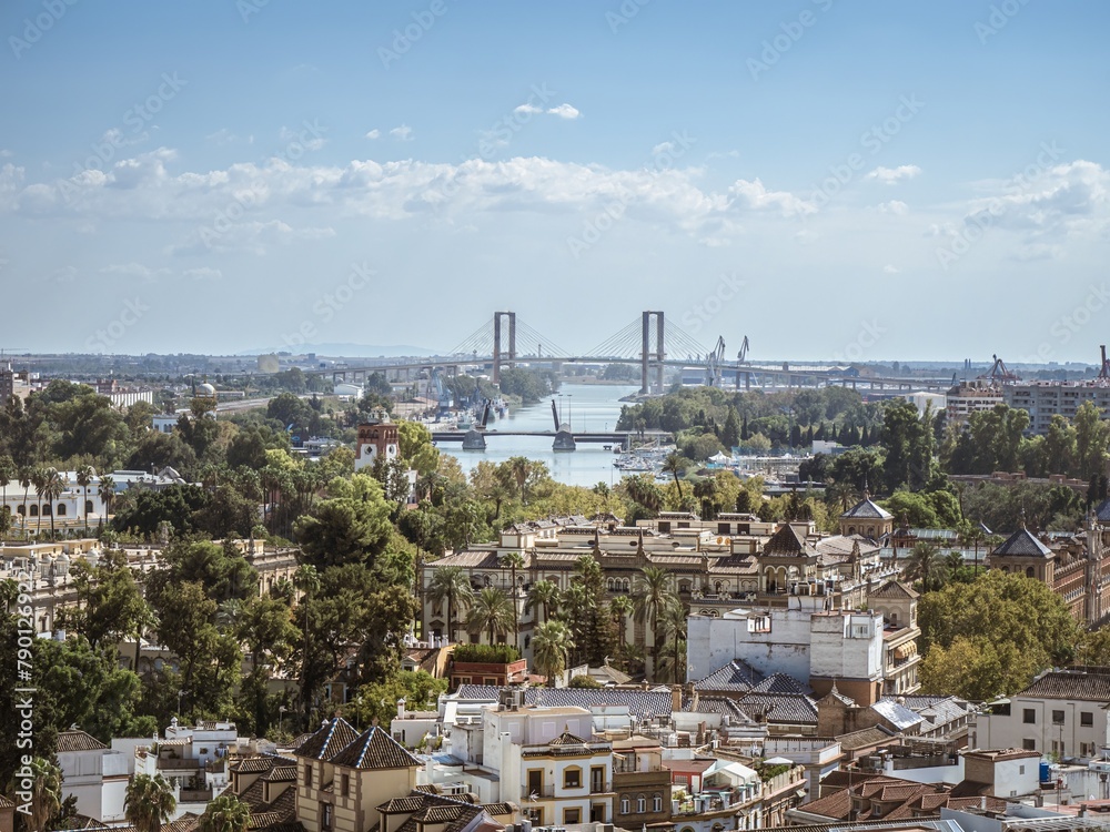 View of the town of Seville with the bridges of the city in the background as seen from the tower of Giralda
