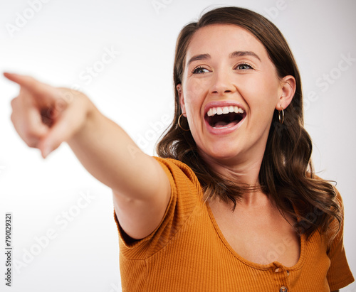 Excited  woman and hand pointing in studio for wow news  announcement or deal info on white background. Forward  attention and happy model show service review  feedback and offer  promo or results