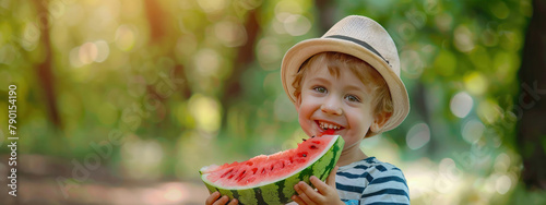 a child eats a watermelon on the background of nature