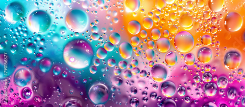 A macro photograph of oil droplets in water  with the mixture forming colorful  abstract shapes for a vibrant background.   background