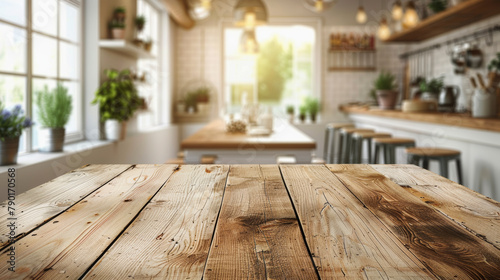 Rustic wooden tabletop foreground with a blurred modern kitchen interior background, featuring a central island and natural lighting.