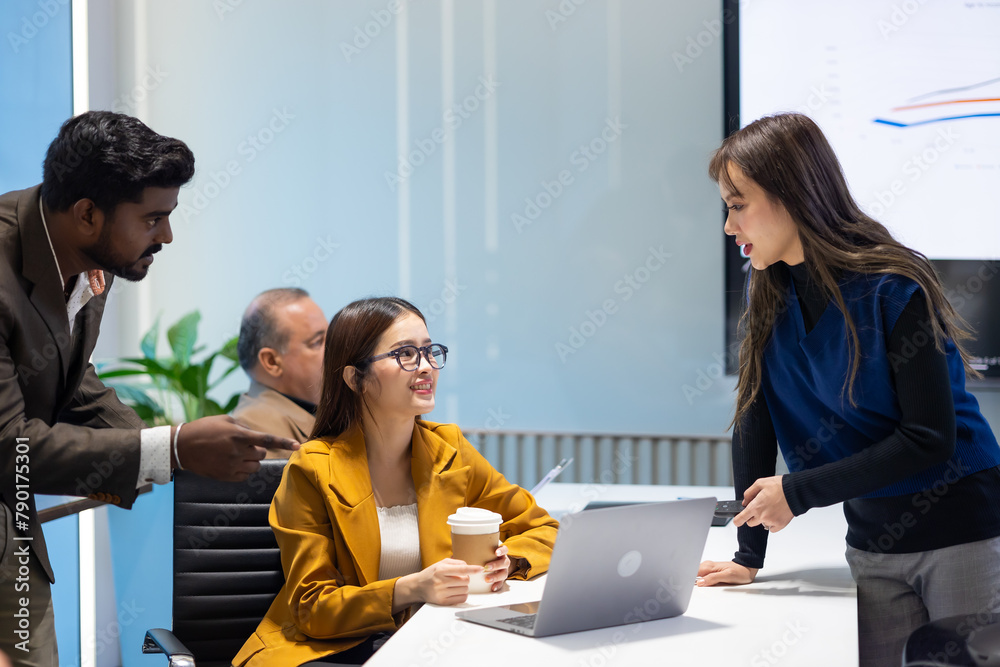 Fototapeta premium Business meeting - Group of diversity men and women sitting in conference room and smiling at meeting research plan in boardroom. Professional business people brainstorming and teamwork concept.