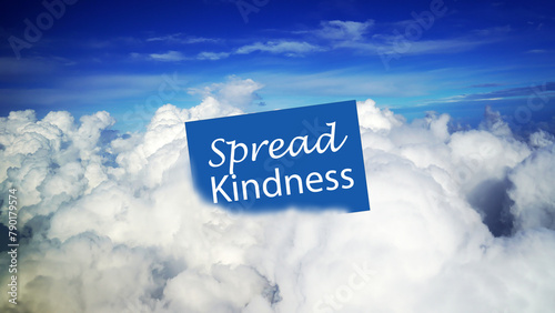 Message on blue notepaper sign on clouds - Spread kindness. Love, compassion and humanity concept with blue sky and white cloud background.