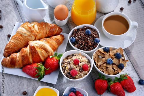 Breakfast served with coffee, juice, croissants and fruits © monticellllo
