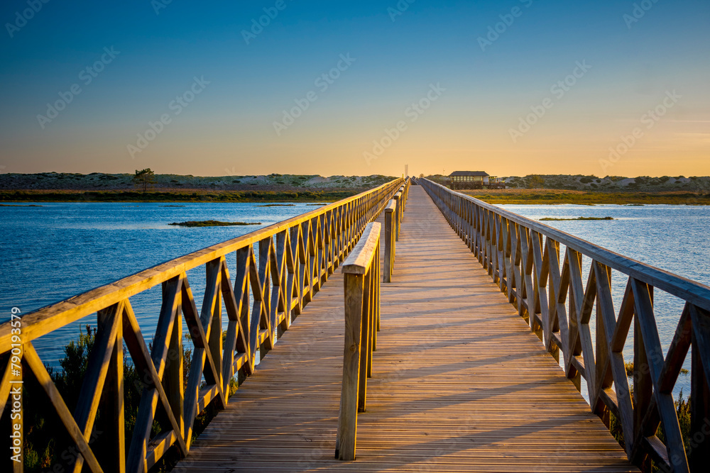 Quinta do Lago Bridge in Ria de Formosa natural park in Faro, Algarve in Portugal during sunset