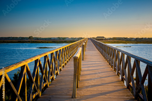 Quinta do Lago Bridge in Ria de Formosa natural park in Faro, Algarve in Portugal during sunset photo