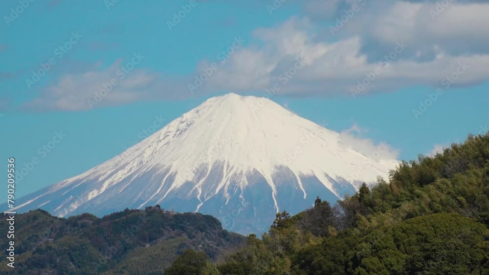 SHIZUOKA, JAPAN - MARCH 2024 : Close up time lapse shot of Mount Fuji with snow on top. Tallest Mountain in Japan. Shot in spring season, sunny daytime. Japanese nature concept video. SHIZUOKA, JAPAN - MARCH 2024 : Close up time lapse shot of Mount Fuji with snow on top. Tallest Mountain in Japan. Shot in spring season, sunny daytime. Japanese nature concept video.