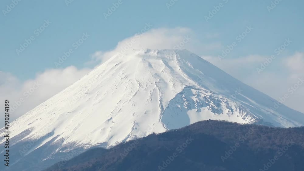 SHIZUOKA, JAPAN - MARCH 2024 : Close up time lapse shot of Mount Fuji with snow on top. Tallest Mountain in Japan. Shot in spring season, sunny daytime. Japanese nature concept video. SHIZUOKA, JAPAN - MARCH 2024 : Close up time lapse shot of Mount Fuji with snow on top. Tallest Mountain in Japan. Shot in spring season, sunny daytime. Japanese nature concept video.
