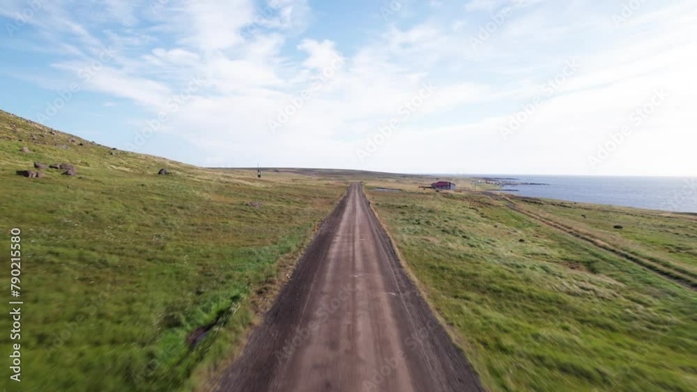 POV Aerial Driving Front View Dirt Road Iceland West Fjords Coast Iceland. Daytime Summer Muddy Dirt Road Drone Aerial. POV Aerial Driving Front View Dirt Road Iceland West Fjords Coast Iceland. Daytime Summer Muddy Dirt Road Drone Aerial.
