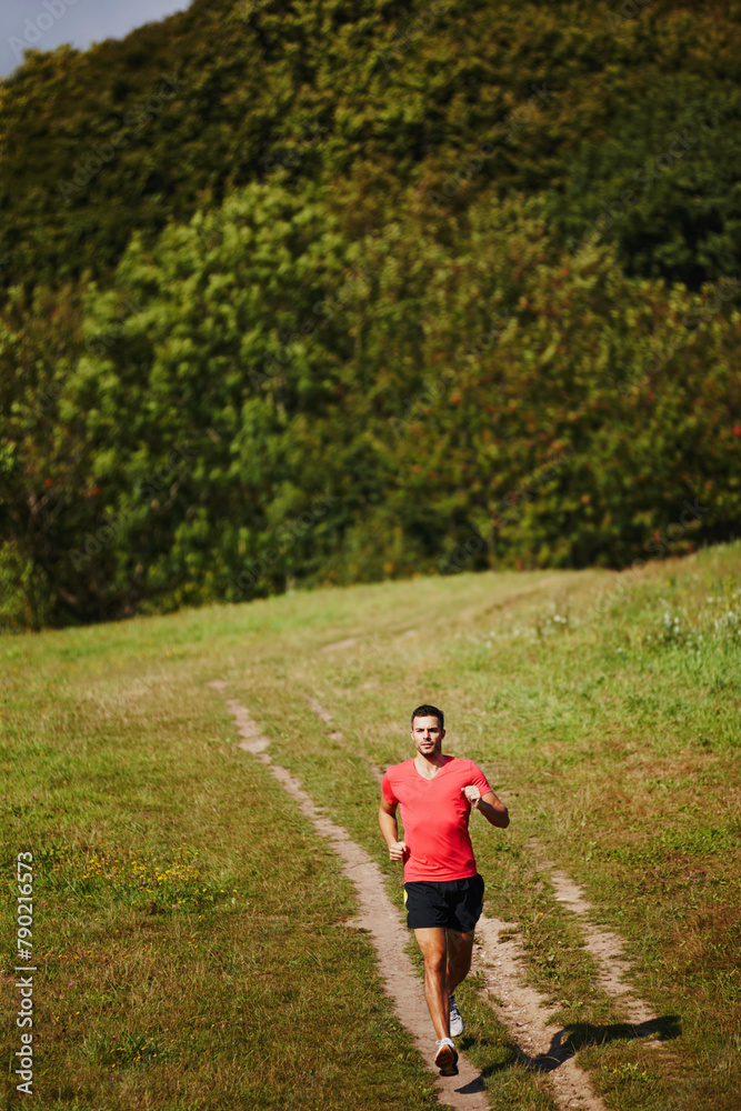 Running, man and cardio outdoor for fitness, health and jogging in nature for workout or exercise. Male athlete, path and wellness for endurance, muscles and strength in gym, sports and training Running, man and cardio outdoor for fitness, health and jogging in nature for workout or exercise. Male athlete, path and wellness for endurance, muscles and strength in gym, sports and training