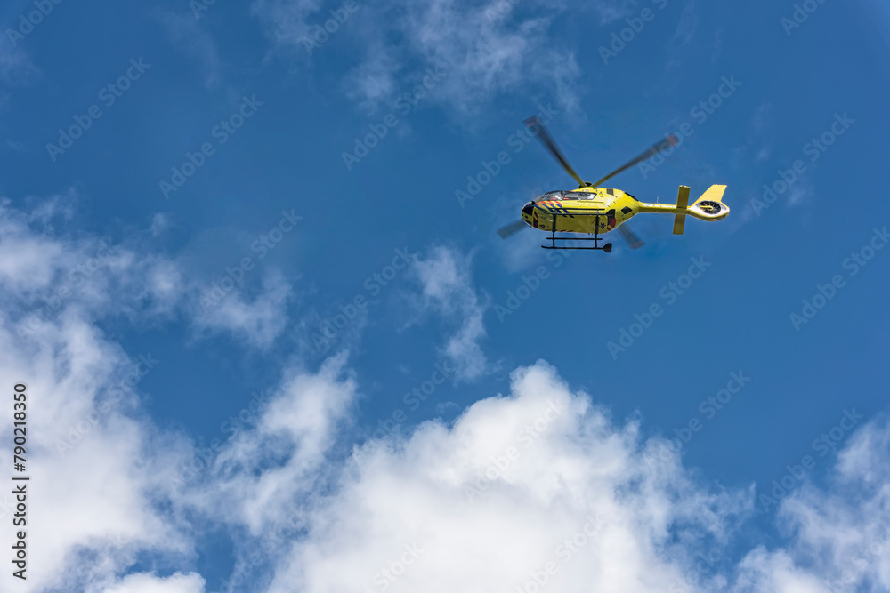 yellow ambulance helicopter flies high in the sky yellow ambulance helicopter flies high in the sky