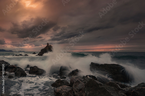 Sunset with cloudy and dramatic sky over the coast of the Cantabrian Sea on Meñakoz beach in Sopelana, Bizkaia