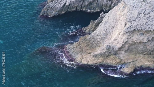 Waves crushing on the coastline rocks